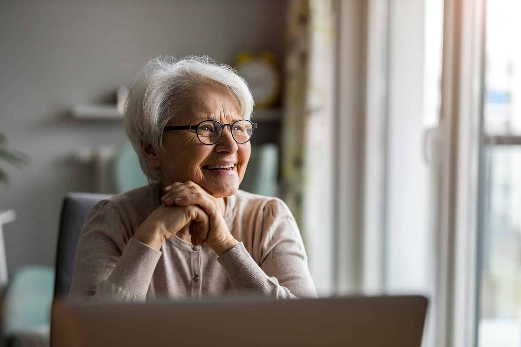 Woman with dental implants smiling in Kingsport, TN