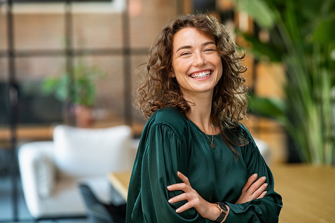 woman smiling after sedation dentistry at Highlands Periodontics and Implant Dentistry