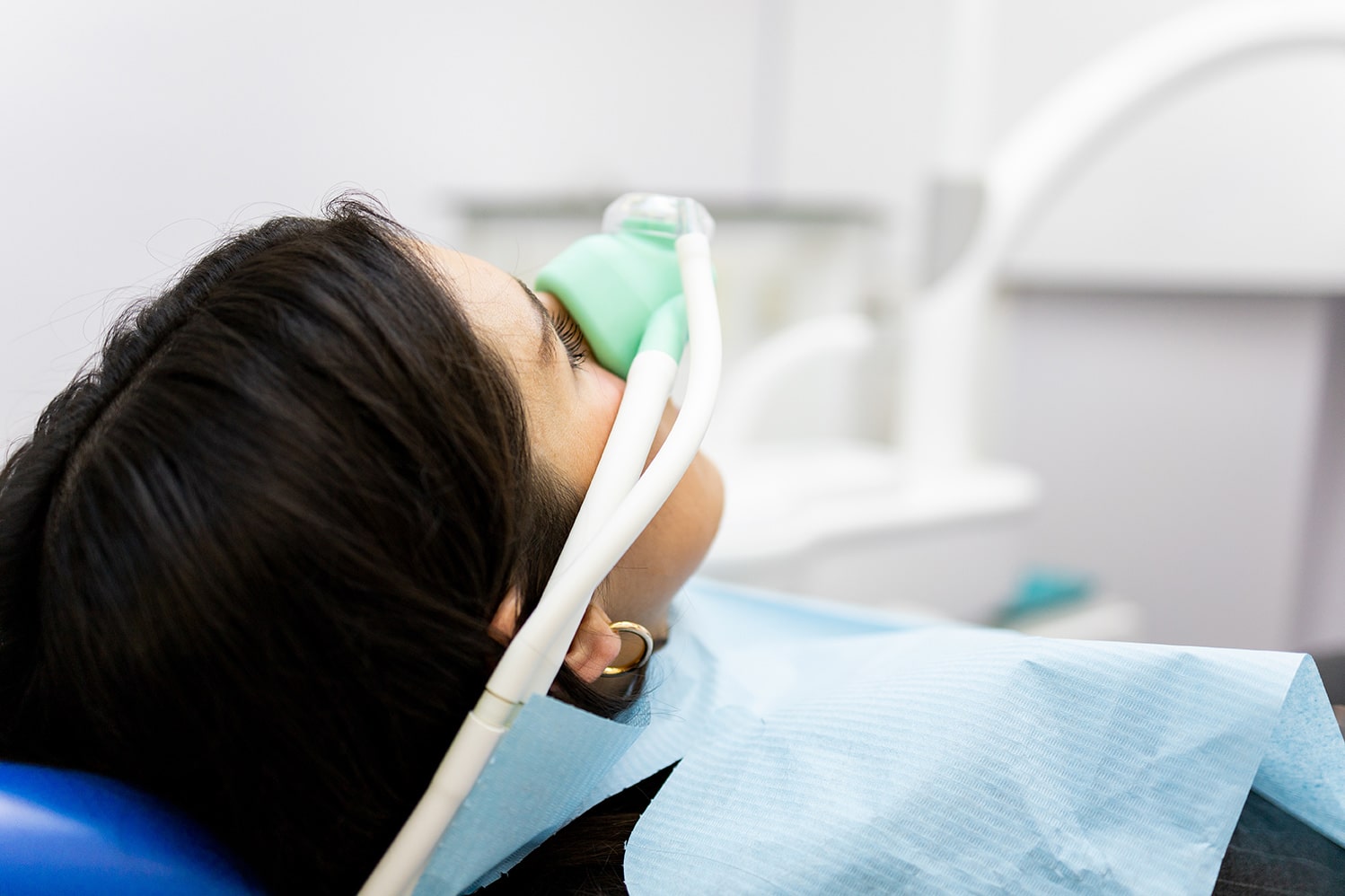 woman recieving nitrous oxide at Highlands Periodontics and Implant Dentistry