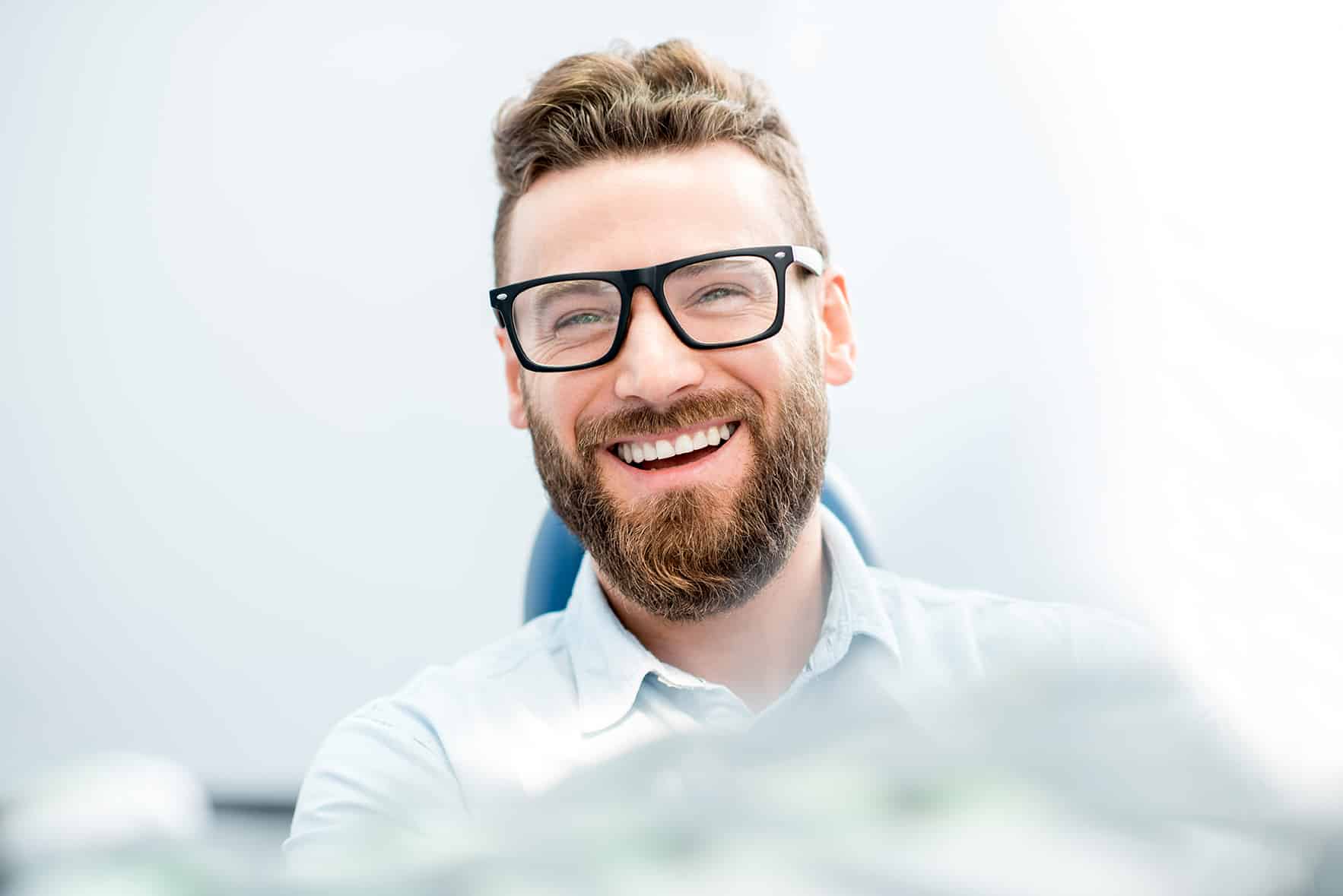 male dental patient smiling during scaling and root planning appointment in kingsport tn