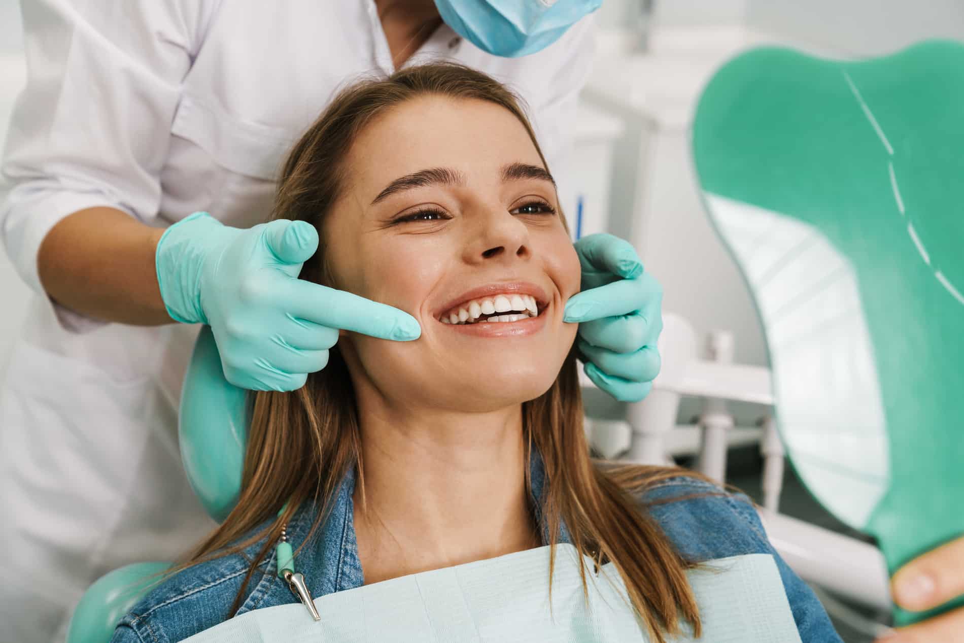 Woman at her dental implant bridge consultation at Highlands Periodontics & Implant Dentistry