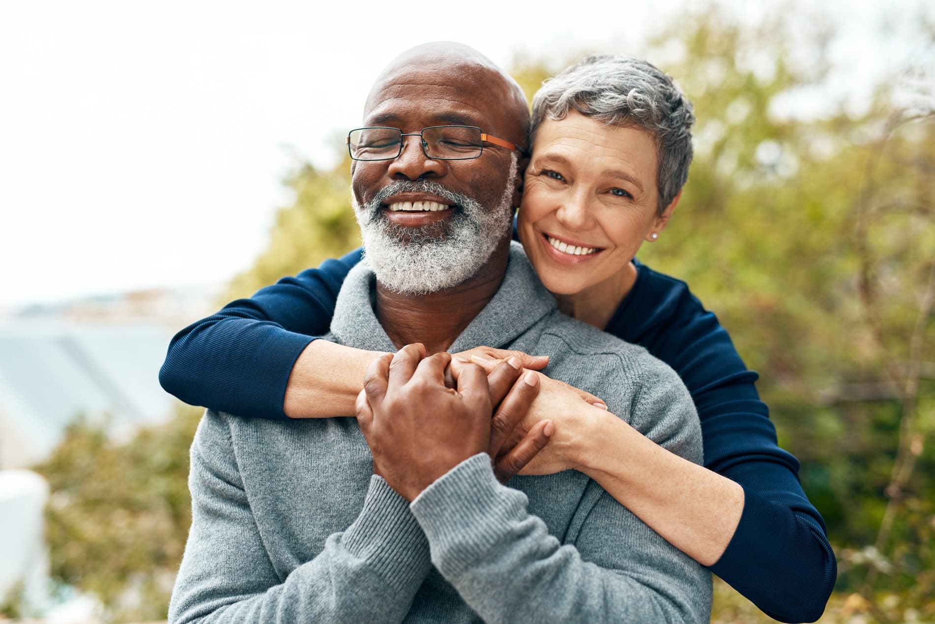 Couple hugging after a successful implant supported denture was place in Kingsport TN